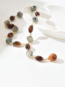 1条高品质棕色花卉灰色图案树脂珠拼接水滴吊坠Y型项链，新款圆形豹纹拼接金链Y型项链，适合女士派对、节日、假日、街头风、送给爱人的礼物、节日佩戴。每颗树脂珠的尺寸和颜色随机选择，树脂珠带有孔洞属于正常现象，敬请谅解。 - 彩色 - 查看 4