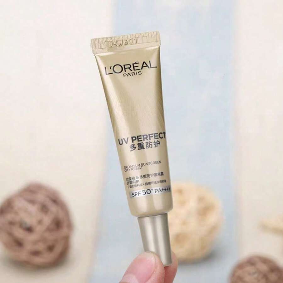 L'Oreal 7.5ml/0.25oz Mini Gold Tube Sunscreen, SPF50+/PA++++. Lightweight Sunscreen. Outdoor Sunscreen. Multi-Protection Sunscreen. Face & Body Sunscreen. UV Protection. - Black Gold - View 1