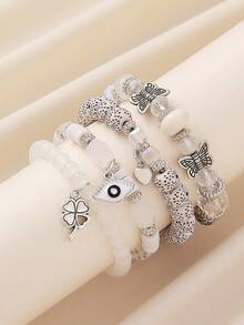 Bộ 4 vòng tay hạt thủy tinh phong cách Bohemian quyến rũ với hình mắt, cỏ bốn lá, trái tim, bướm, và hạt bồ đề, thích hợp cho nữ giới đeo hàng ngày, đi biển và du lịch. - Mắt, cỏ bốn lá, bướm - Xem 7