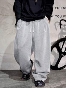 1 chiếc quần thể thao nam dáng rộng, màu trơn, ống rộng, có dây rút ở eo và túi lớn, thích hợp cho đi bộ hàng ngày, đi làm, du lịch và mọi mùa, nhẹ và thoải mái, chất liệu 100% polyester. - Xám - Xem 4