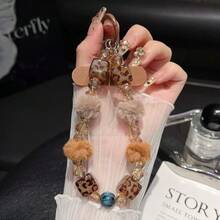 Cordón para teléfono de moda para otoño/invierno con pompón de piel, estampado de leopardo, cadena de muñeca con cristales, accesorio colgante de estética de lujo, brazalete suave y sencillo en negro y blanco - Multicolor - Ver 9