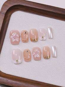 Bộ 10 móng giả ngắn hình vuông giúp bạn trông thanh lịch và rạng rỡ, móng giả dán thủ công, màu hồng nhạt và nude chuyển sắc, họa tiết hoa anh đào 3D nổi bật, trang trí bằng đường viền vàng và đính đá nhỏ, có thể tháo rời và tái sử dụng, bao gồm 1 keo dán và 1 dũa móng, dành cho phụ nữ và bé gái, sử dụng hàng ngày, đi làm, đi học, hẹn hò, dự tiệc, làm quà tặng cho người yêu. - Nhiều màu - Xem 3