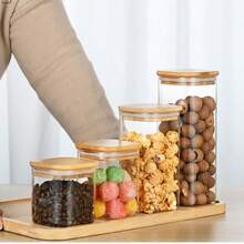 高品质透明玻璃储物罐，配竹盖——密封性极佳，适用于食品储存和厨房收纳。这款优质玻璃罐采用耐用防刮材质，透明设计确保长期使用和易于清洁。方形设计和可堆叠结构非常节省厨房或食品储存空间，密封性极佳的竹盖可确保食物更长时间保持新鲜。 - 彩色 - 查看 4