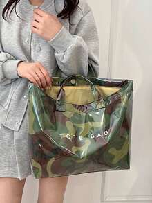 女士时尚手提包，PVC透明迷彩图案托特包，防水户外休闲包，大容量沙滩包，休闲风格，大容量，固定肩带，魔术贴封口，涤纶内衬，随机印花设计，适合工作和通勤 - 彩色 - 查看 10
