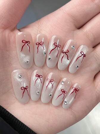 Set de 10 uñas postizas decorativas para el Día de San Valentín, con diseño suave y dulce, de forma ovalada larga, pintadas a mano con degradado, con efecto brillante, estilo ojo de gato, lazo y cristales, para hacer que los dedos se vean estilizados y elegantes. Incluye uñas de ballet removibles y de cobertura completa.