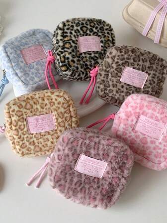 Organizador de toallas sanitarias con estampado de leopardo suave, bolsa de viaje esencial y multifuncional para mujeres, cartera digital, monedero, con cierre de cremallera, perfecto para viajes y uso diario, gran capacidad para guardar toallas sanitarias