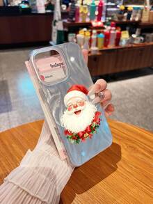 Papá Noel sonriente con adornos festivos es alegre. Esta elegante funda para teléfono es compatible con los modelos  16, 15, 14 Pro Max, 13, 12, 11, XR y XS Plus. Fabricada en silicona TPU, ofrece protección contra golpes y caídas, además de una sensación superior. Es un regalo ideal para familiares, amigos y seres queridos, y una opción perfecta para Navidad. - transparente - Ver 1