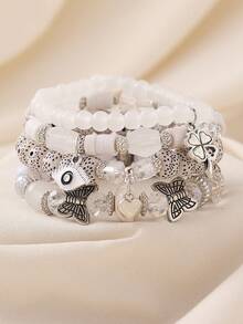 Bộ 4 vòng tay hạt thủy tinh phong cách Bohemian quyến rũ với hình mắt, cỏ bốn lá, trái tim, bướm, và hạt bồ đề, thích hợp cho nữ giới đeo hàng ngày, đi biển và du lịch. - Mắt, cỏ bốn lá, bướm - Xem 15