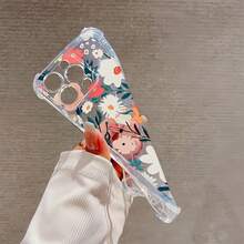Estampado floral con colores vibrantes y fondo blanco. Esta elegante funda es compatible con los modelos  16, 15, 14 Pro Max, 13, 12, 11, XR y XS Plus. Fabricada en silicona TPU, ofrece protección contra golpes y caídas, además de una sensación superior. Es un regalo ideal para familiares, amigos y seres queridos, y una opción perfecta para Navidad. - transparente - Ver 2