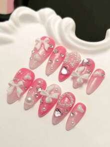 Bộ 10 móng giả dán thủ công, hình hạnh nhân cỡ trung bình, móng tay ngày Valentine, móng tay màu hồng lãng mạn, móng tay dễ thương, móng tay nơ trắng đính ngọc trai hình trái tim, móng tay ombre hồng, móng tay đính pha lê hình trái tim hồng, móng tay kiểu ballet, móng giả có thể tháo rời, móng tay hình hạnh nhân, móng giả dán tái sử dụng, dụng cụ làm móng, bộ dụng cụ làm móng, thích hợp cho tiệc tùng, khiêu vũ, sử dụng hàng ngày, tụ họp sinh viên, kèm theo gel dẻo và dũa móng, phụ kiện làm móng DIY. - Hồng - Xem 1