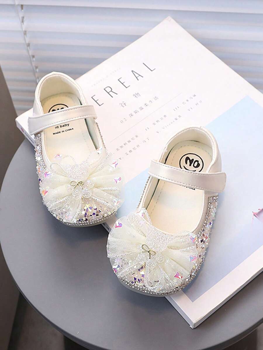 Zapatos planos de princesa para niños - Diseño con brillo de strass y lazo, suela suave para niñas pequeñas, perfectos para fiestas/bodas - Blanco marfil - Ver 1
