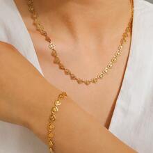 Ensemble de bijoux en acier inoxydable avec pendentif et bracelet en forme de cœur creux. Accessoires de mode simples et élégants pour femmes - Bijoux ajourés en forme de cœur - Voir 11