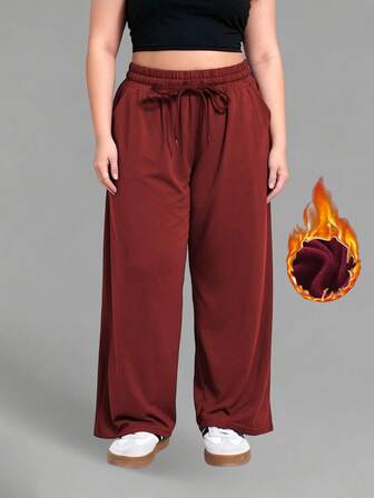Fleecegevoerde joggingbroek voor dames in grote maten, geschikt voor temperaturen tot -5°C, casual broek met wijde pijpen en trekkoord in de taille, inclusief zakken, losse broek voor hardlopen en workouts in de buitenlucht.