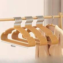 10个/5个加厚防滑树脂弧形晾衣架，适用于阳台晾晒衣物，非常适合紧凑型居住空间和阳台布置，弧形架设计可最大限度地提高空气流通，加厚防滑表面和防潮树脂涂层，为毛衣、T恤、毛巾和精致衣物提供多种晾晒选择；是春季大扫除、换季整理和日常收纳的理想之选，易于放置、存放和搭配兼容的晾衣配件，同时保持阳台或杂物间的整洁有序。