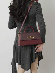 1个女士手提包，硬挺方正造型，时尚优雅女士单肩/斜挎包，黑色