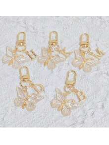 时尚创意渐变闪亮蝴蝶字母钥匙扣，A-Z字母款式，优雅独特，可挂在女士包包或车钥匙上。DIY手机和包包挂件，生日、节日、派对、乔迁、母亲节、教师节、复活节、情人节、朋友聚会、毕业季、返校季小礼物，送给朋友或家人的独特可爱礼物。 - 彩色 - 查看 3