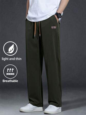 男士宽松抽绳腰斜口袋纯色长裤，秋季