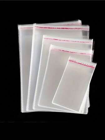 50 st/100 st genomskinliga självhäftande OPP-påsar, genomskinliga små plastpåsar, lämpliga för små tillbehör, baktillbehör, nyckelringar, hängen, kort, presentförpackningar, genomskinliga förvaringspåsar, förpackningspåsar, presentpåsar