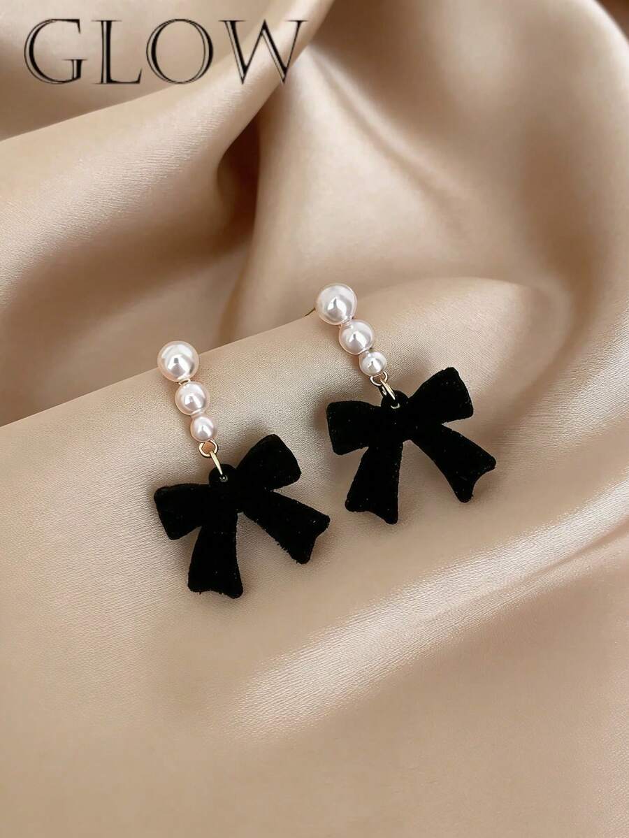 Đôi bông tai hình nơ nhỏ xinh xắn, dịu dàng dành cho các bé gái, thích hợp đeo hàng ngày hoặc trong các dịp lễ. - Cây cung - Xem 1