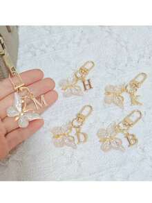 时尚创意渐变闪亮蝴蝶字母钥匙扣，A-Z字母款式，优雅独特，可挂在女士包包或车钥匙上。DIY手机和包包挂件，生日、节日、派对、乔迁、母亲节、教师节、复活节、情人节、朋友聚会、毕业季、返校季小礼物，送给朋友或家人的独特可爱礼物。 - 彩色 - 查看 5