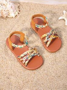 1双女童棕色编织凉鞋，鞋面采用彩色编织，弹性踝带贴合脚型，饰有流苏和搭扣，平底防滑，适合日常穿着、家庭出游和夏季购物。 - 亮橙色 - 查看 8