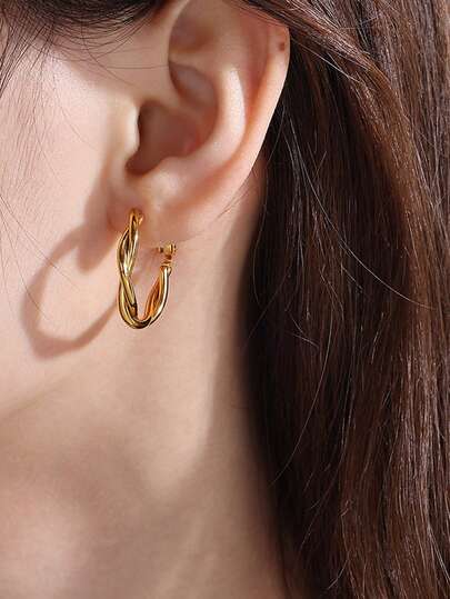 A Pair Of Gold Twisted Hoop Earrings For Women, Bold And Minimalist Rope Design, Versatile Luxury Statement Piece, Architectural Vintage Inspired Jewelry