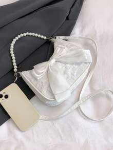 这款可爱百搭的斜挎包饰有蝴蝶结和珍珠，采用尼龙拉链和可调节肩带，适合日常使用、上学、旅行，可轻松收纳日常必需品。这款多功能单品时尚前卫，可轻松搭配各种风格和场合。 - 白色 - 查看 2