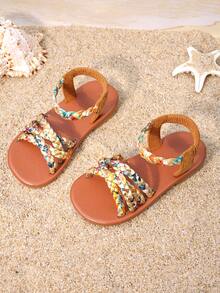 1双女童棕色编织凉鞋，鞋面采用彩色编织，弹性踝带贴合脚型，饰有流苏和搭扣，平底防滑，适合日常穿着、家庭出游和夏季购物。 - 亮橙色 - 查看 6