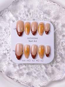 10片手工制作的杏仁形深棕色法式美甲贴纸，带有橙色渐变和星爆图案，并饰以手工制作的橙色渐变和不对称金色圆圈。 - 彩色 - 查看 3