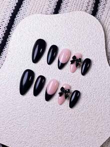 Bộ 10 miếng dán móng tay thủ công hình hạnh nhân màu đen, trang trí nơ, với đầu móng được sơn đen thủ công và điểm nhấn là nơ ruy băng đen. Thanh lịch, lãng mạn nhưng tối giản, bộ dán móng này toát lên vẻ sang trọng, gợi cảm và nhẹ nhàng. Thích hợp cho sử dụng hàng ngày, hẹn hò, xem hòa nhạc và các dịp kinh doanh nhẹ nhàng, một món quà tuyệt vời dành cho phụ nữ và các cô gái. - Nhiều màu - Xem 4