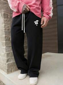 男士春夏日常休闲裤：透气舒适，十字图案宽松休闲裤，采用混色面料，十字图案装饰，弹性抽绳腰带，宽松裤脚和侧袋。是春夏日常出行和休闲放松外出的理想之选。 - 黑色 - 查看 2