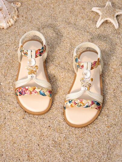 1 Pair Girls' Beige Printed Woven Strap Sandals, Featuring Printed Woven Upper, Pearl Decor, Open Toe Flat Design, Comfortable And Casual, Suitable For Beach And Summer Picnics