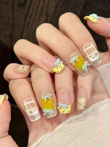 10 miếng dán móng tay hình chữ nhật dài vừa phải, làm thủ công, màu vàng và xanh dương, lấp lánh, mềm mại và dễ thương, phù hợp cho phụ nữ và bé gái, dùng được quanh năm, thích hợp cho các dịp lễ và sử dụng hàng ngày. - Màu vàng - Xem 2