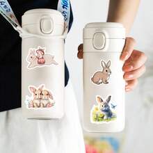 55-teiliges Hasen Aufkleber Set, PVC Cartoon Hasen Aufkleber, geeignet für verschiedene Oberflächen wie Kunststoff, Glas, Stoff und Keramik - verschiedene unregelmäßige Formen, perfekt für DIY, Basteln und Dekoration, geeignet für Personen ab 12 Jahren.