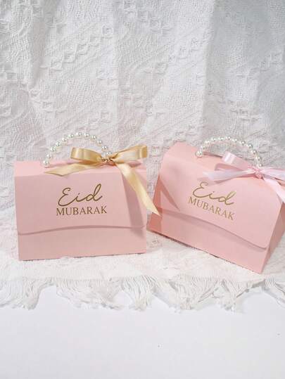 Set de 10 pungi cadou Eid Mubarak cu mâner perlat, roz cu imprimeu auriu "Eid Mubarak" și funde din panglică de satin (șampanie/roz), ideale pentru sărbătorile Eid Al-Fitr, cadouri pentru festivalurile islamice, cadouri feminine pentru invitații la nuntă și decor cultural elegant