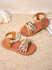1双女童棕色编织凉鞋，鞋面采用彩色编织，弹性踝带贴合脚型，饰有流苏和搭扣，平底防滑，适合日常穿着、家庭出游和夏季购物。 - 亮橙色 - 查看 3
