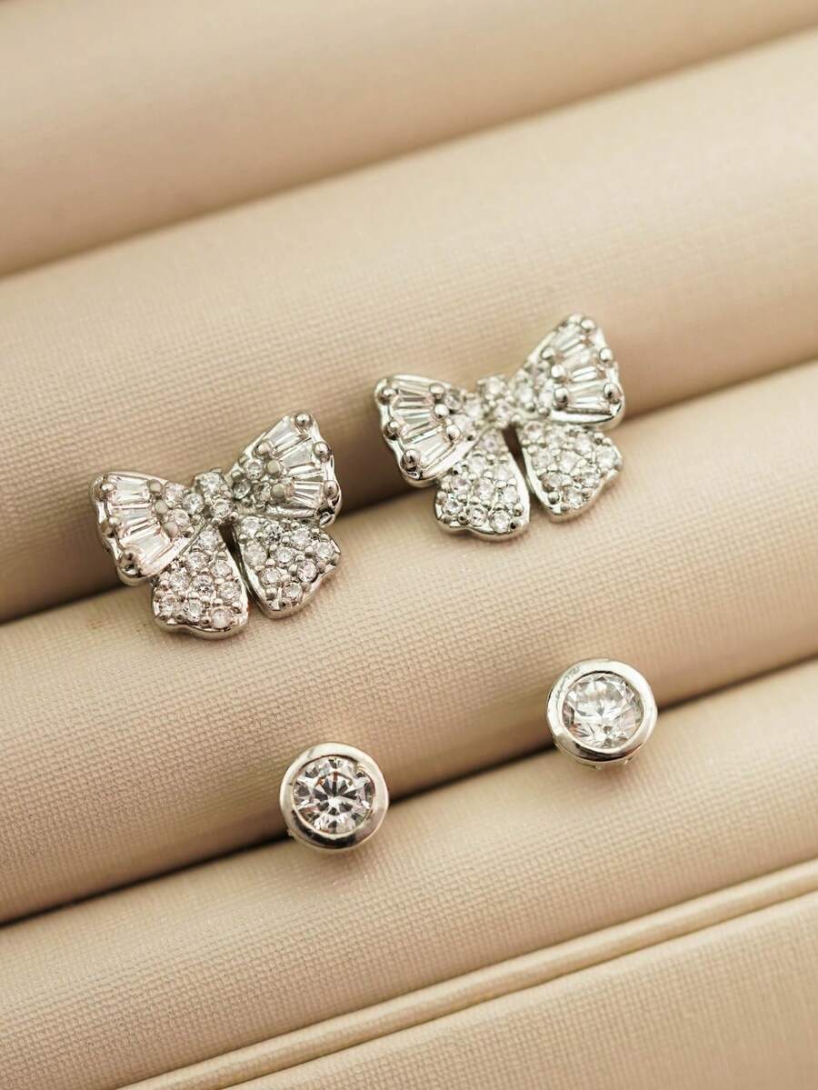 1 par de Brincos Feminino formato Laço com pedras cravejadas