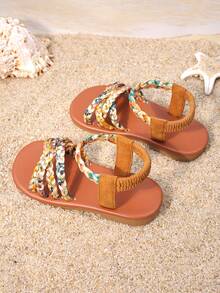 1双女童棕色编织凉鞋，鞋面采用彩色编织，弹性踝带贴合脚型，饰有流苏和搭扣，平底防滑，适合日常穿着、家庭出游和夏季购物。 - 亮橙色 - 查看 5