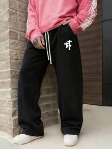 男士春夏日常休闲裤：透气舒适，十字图案宽松休闲裤，采用混色面料，十字图案装饰，弹性抽绳腰带，宽松裤脚和侧袋。是春夏日常出行和休闲放松外出的理想之选。 - 黑色 - 查看 3