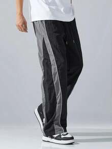 Quần dài ống đứng rộng rãi dành cho nam, chất liệu nylon, quần thể thao nam, gấu quần có dây rút thời trang, thiết kế phối màu tương phản, phong cách đường phố cho mùa xuân và mùa thu. - màu đen - Xem 5