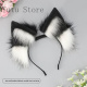 Oreja eléctrica de pelo blanco y negro