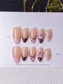 Bộ 10 miếng dán móng tay thủ công hình hạnh nhân màu nâu hồng kiểu Pháp, trang trí bằng chấm bi và họa tiết chạm khắc, điểm xuyết bằng hoa 5 cánh 3D màu hồng thủ công, chấm bi Pháp màu nâu hồng vẽ tay và các đường lượn sóng 3D. Thanh lịch và lãng mạn nhưng tối giản, bộ dán móng tay này toát lên vẻ sang trọng cao cấp, gợi cảm và nhẹ nhàng. Thích hợp cho sử dụng hàng ngày, hẹn hò, hòa nhạc hoặc các dịp kinh doanh, cũng là món quà hoàn hảo cho phụ nữ và các cô gái. - Nhiều màu - Xem 10