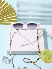 1副男女童（7-14岁）方形镜框时尚眼镜，配1条串珠眼镜链，方便假日活动和度假佩戴，附带眼镜盒。 - 彩色 - 查看 9