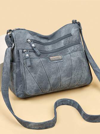 Bolsa transversal diagonal feminina de cor sólida em PU com alça de ombro ajustável, vários bolsos, fechamento em zíper, forro em poliéster, leve e ideal para uso diário.