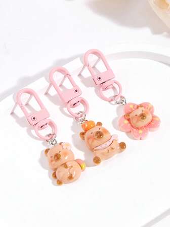 1 st kapybaranyckelring, tecknad kapybaraväskberlock, söt nyckelring, djurnyckelring, hörlurshängare, litet tillbehör, väskhänge, bilnyckelring, nyckelringssnodd, nyckelring, nyckelringstillbehör, nyckelring, parnyckelring, present till kvinnor, julklapp, julklapp, födelsedagspresent, vänpresent, högtidspresent, evenemangssouvenir, festgåva