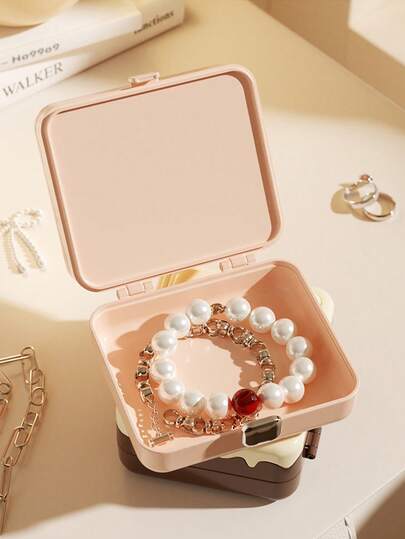 1个便携式迷你旅行收纳整理盒，巧克力造型首饰收纳盒带镜子，是送给女性的理想礼物，可收纳戒指、耳环、项链、手镯和其他配饰，非常适合情人节。