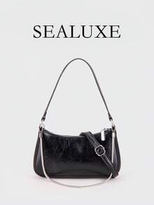 Eine zeitgenössische Tasche in Form eines französischen Baguettes, mit Metallketten-Details. Aus schwarzem PU-Leder gefertigt, bietet diese minimalistische Damen-Umhängetasche einen verstellbaren langen Riemen für das Tragen über der Schulter, was sie ideal für den täglichen Einkauf und ähnliche Anlässe macht.