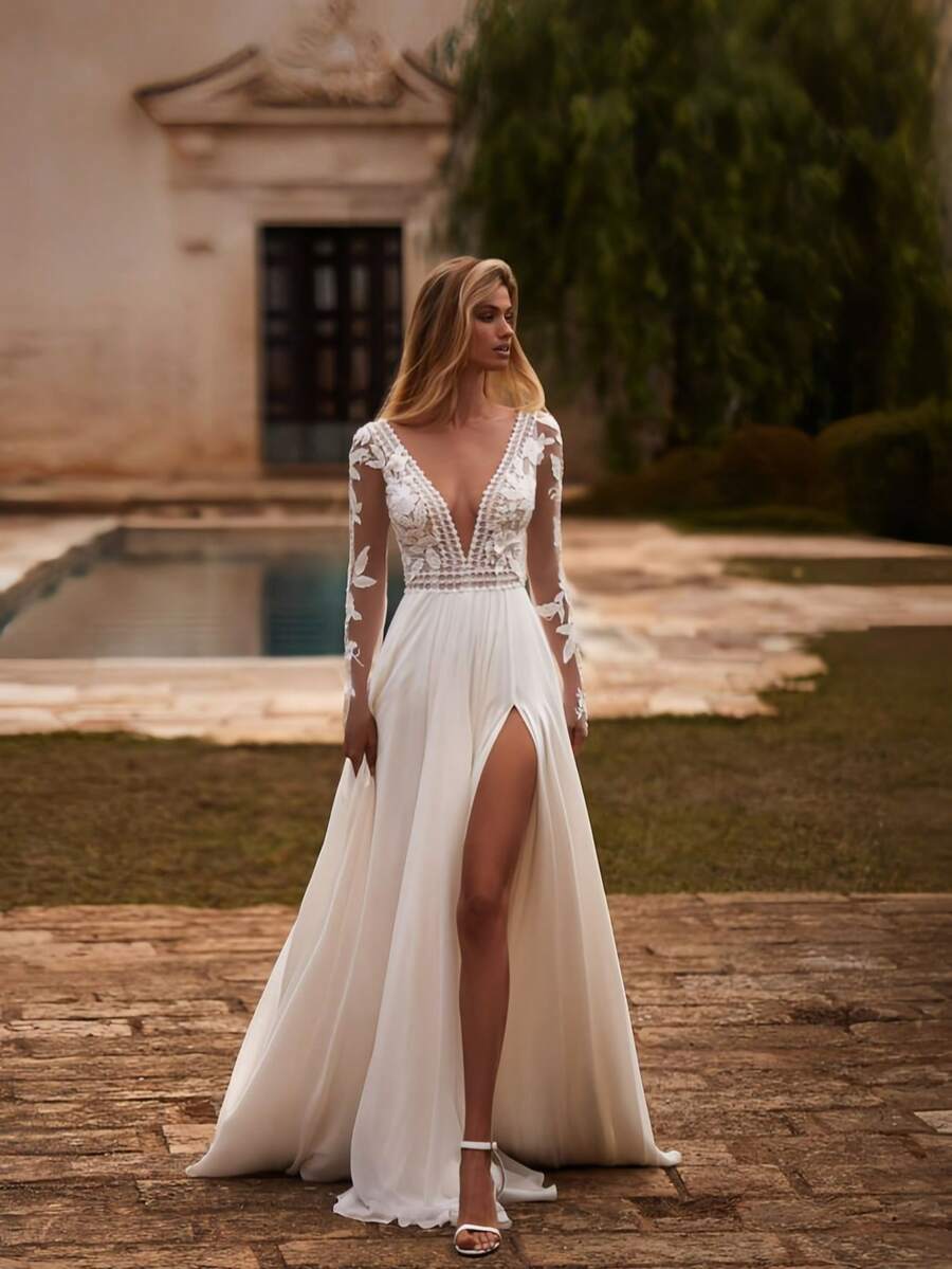 Sleek Long Sleeve A-Line Wedding Dress With Deep V Neckline And High Side Slit – Luxe Floor-Length Ivory Bridal Gown Featuring A Dramatic Plunge Front, Elegant Full-Length Sleeves, And A Flowing A-Line Silhouette With A Graceful Leg Slit. This Sophisticated Gown Offers A Modern And Alluring Look, Perfect For Creating An Enchanting And Captivating Bridal Moment. Ideal For Weddings, Holiday Celebrations, Christmas Galas, Halloween Festivities, Prom Nights, Birthday Soirees, Anniversary Dinners, And Special Evenings. A Stunning Formal Gown Suitable For Bridal Ceremonies, Wedding Receptions, Festive Events, Formal Dinners, Graduation Balls, Homecoming Dances, Cocktail Receptions, Bridal Party Attire, And Unforgettable Celebration Moments. - 白色 - 查看 1