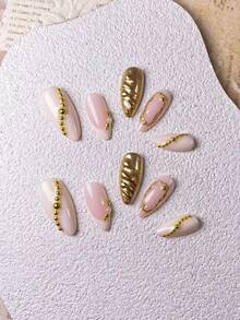 Bộ 10 miếng dán móng tay hình hạnh nhân màu trắng sữa thủ công, được trang trí bằng bột gương tròn vàng và họa tiết tương phản trắng sữa điểm xuyết hạt vàng. Bộ móng giả thanh lịch, lãng mạn và tối giản này toát lên vẻ tinh tế, gợi cảm và sang trọng. Thích hợp cho sử dụng hàng ngày, hẹn hò, hòa nhạc và các dịp công sở nhẹ nhàng, là món quà tuyệt vời dành cho phụ nữ và các cô gái. - Nhiều màu - Xem 5