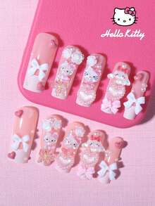 SANRIO 24片粉色法式长方形美甲贴纸，包含3D可爱装饰图案，如爱心、蝴蝶、花朵和珍珠，附赠1瓶胶水和1把指甲锉，适合女性日常生活和派对场合。 - 查看 2